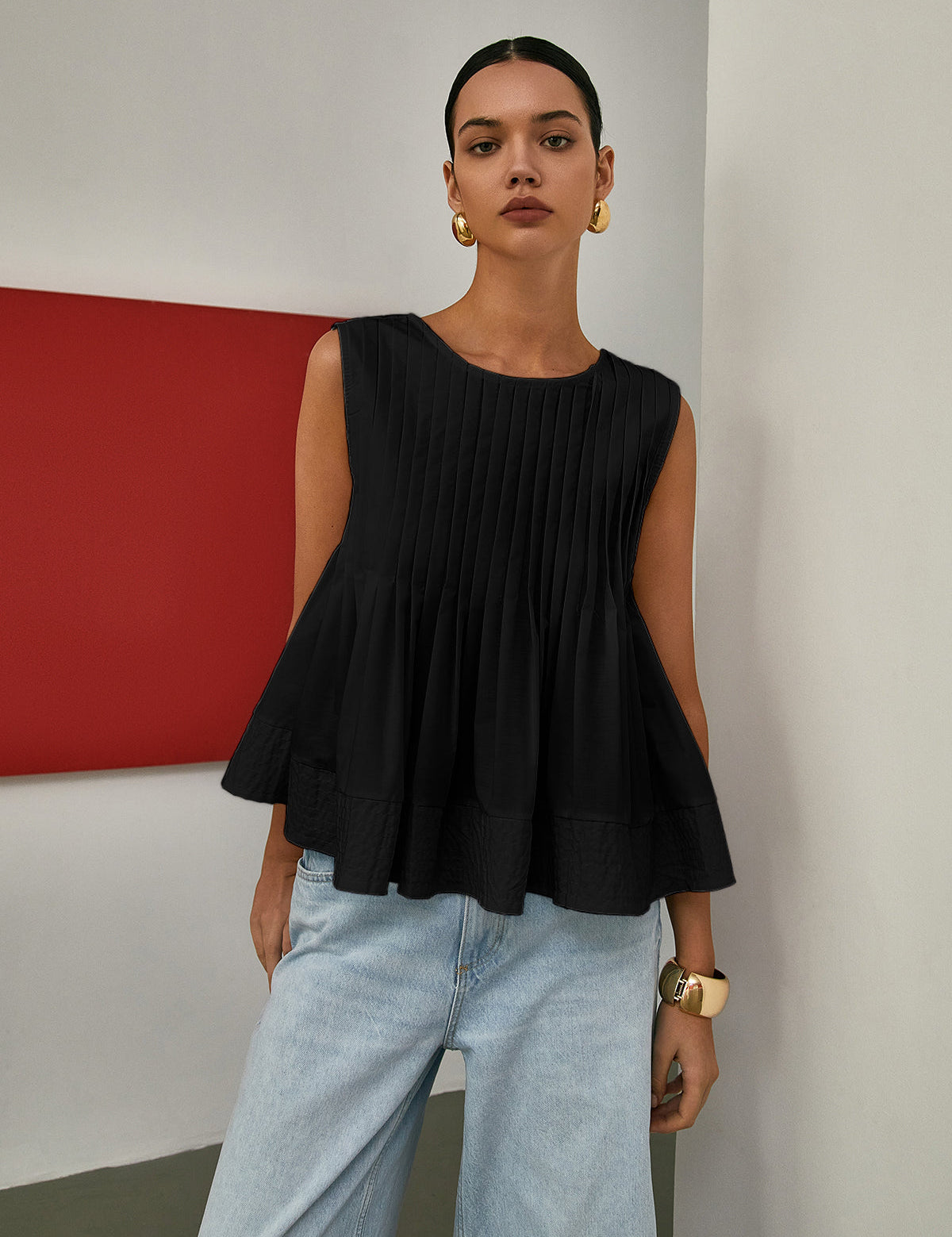 Bluzka bez rękawów z plisowanym peplum