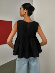 Bluzka bez rękawów z plisowanym peplum