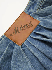 Asymetryczna plisowana spódnica mini z denimu